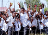 South Africa - Soweto (Gauteng province): uniformed school boys gather for a photograph behind the school's razor wire fence - photo by R.Eime