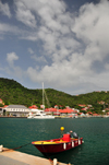 Gustavia, St. Barts / Saint-Barthlemy: small boat and the green hills around the harbour - photo by M.Torres