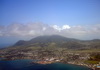 Basseterre, St Kitts, St Kitts and Nevis: the Kittitian capital and the island seen from the air - Mount Liamuiga in the clouds - photo by M.Torres