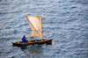 Santana, Cantagalo district, So Tom and Prcipe / STP: fisherman enters the Ocean is fragile sailing boat / pescador numa frgil casca de noz - photo by M.Torres