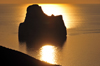 Porto Flavia, Masua, Sardinia / Sardegna / Sardigna: Pan di Zucchero islet at sunset - golden reflection on the Gonnesa gulf - faraglione - photo by M.Torres