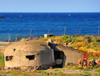 Porto Torres / Pltu Trra, Sassari province, Sardinia / Sardegna / Sardigna: coastal bunker in ruins - a touch of Albania - photo by M.Torres