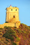 Pula, Cagliari province, Sardinia / Sardegna / Sardigna: Spanish tower of SantEfisio / Coltelazzo - lighthouse on Cape Pula - coastal tower built overlooking the ruins of Nora - Gulf of Cagliari - Sulcis-Iglesiente region - photo by M.Torres