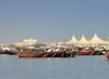 Al Qatif, Eastern Province, Saudi Arabia: fishing dhows moored by the fish market - Tarout Bay, Persian Gulf - photo by M.Torres