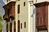 Jeddah, Mecca Region, Saudi Arabia: Al Balad historic district - arabian closed balconies, mashrabiyas - Hejazi architecture of Bait Al Balad and a modern facade - Unesco world heritage site - photo by M.Torres