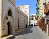 Jeddah, Mecca Region, Saudi Arabia: Nadalah Ibn Khalid Lane, Al Shafi Mosque on the left and Hijaz architecture buildings on the right - Al Mazloum, Al Balad district, Historic Jeddah, UNESCO world heritage site - photo by M.Torres