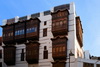 Jeddah, Mecca Region, Saudi Arabia: Matbouli House Museum / Beit Matbouli - hedjazi architecture in Al Balad district - Arabian wooden balconies (rawasheen / mashrabiyas), Historic Jeddah, UNESCO world heritage site - photo by M.Torres