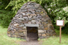 Scotland - Kilmartin: Recreation of a stone age beehive hut located next to Kilmartin House archaeological museum - photo by C. McEachern