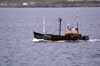 Scotland - Islay Island - Port Ellen - Inner Hebrides : a fishing vessel sets out to sea - photo by C.McEachern