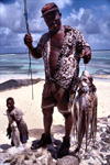 Seychelles - La Digue island: fisherman and his catch - octopus - photo by F.Rigaud