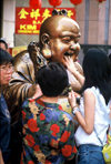 Singapore / SIN : happy Buddha - caresses - photo by S.Lovegrove