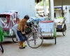 Singapore: a veteran rickshaw driver prepares for the day's toil (photo by R.Eime)