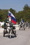 Slovenia - Lipica / Lipizza - Goriska region: Lipica stud farm - Combined driving event - the dressage test - Carriage parade - Slovenian flag - photo by I.Middleton