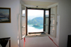 Slovenia - window - view across Lake Bled to island church from inside castle - photo by I.Middleton