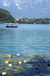 Slovenia - People rowing across Lake Bled - photo by I.Middleton