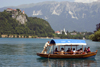 Slovenia - Pletna rowing tourists on lake Bled - photo by I.Middleton