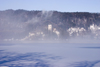 Slovenia - mist - view across to the island church on Lake Bled when frozen over in winter - photo by I.Middleton