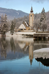 Slovenia - Ribcev Laz - St John's church - view across Bohinj Lake in winter - photo by I.Middleton