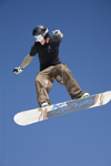Slovenia - Snowboarder on Vogel mountain in Bohinj - jumper and sky - photo by I.Middleton