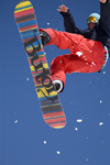 Slovenia - Snowboarder on Vogel mountain in Bohinj - rainbow board - photo by I.Middleton