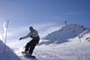 Slovenia - hill with cross and snowboarder on Vogel mountain in Bohinj - photo by I.Middleton