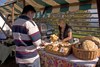 Slovenia - Jance: woman selling local produce at the Chestnut Sunday festival - photo by I.Middleton