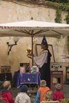 Slovenia - Kamnik Medieval Festival: magician entertaining children - photo by I.Middleton
