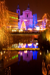 river Ljubljanica and the Franciscan church at night - Christmas lights, Ljubljana , Slovenia - photo by I.Middleton
