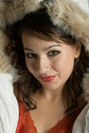 Young woman in a glamorous fashion pose wearing a winter parka with fur lined hood creative, lifestyle, portrait - photo by D.Smith