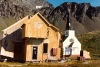 South Georgia Island - Grytviken: the Norwegian church beside the dilapidated working quarters (photo by G.Frysinger)
