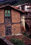 Spain - Cantabria - Potes - red brick building - photo by F.Rigaud
