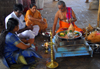 Galle, Southern Province, Sri Lanka: Hindu temple - Brahmin and family during a religious ceremony - puja - photo by M.Torres