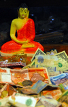 Kandy, Central province, Sri Lanka: Buddha, rupees and dollars - Sri Dalada Maligawa - Temple of the Sacred Tooth Relic - photo by M.Torres