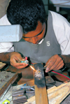 Getambe, Central province, Sri Lanka: precision welder - jewellery factory - photo by M.Torres