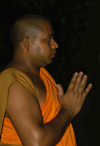 Kandy, Central Province, Sri Lanka: Bhikkhu - praying monk, Temple of the Tooth, Kandy - photo by B.Cain