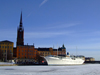 Stockholm, Sweden: Riddarholmen and boat seen from the ice - photo by M.Bergsma