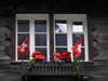 Switzerland - Zermatt, Valais canton: patriotic window - Swiss flags - photo by J.Kaman