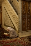 Damascus: Omayyad Mosque - muslim man praying beside minbar (photographer: John Wreford)