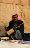 Palmyra / Tadmor, Homs governorate, Syria:playing a Bedouin Rabab, a spike fiddle with quadrilateral sound box covered with skin and a single horsehair string - played with a horsehair bow - Rababah - photo by M.Torres / Travel-Images.com