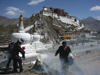 Tibet - Lhasa: Potala palace, stupas, pilgrimns and ritual fire - photo by M.Samper