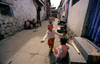 Lhasa, Tibet: street life behind Jokhang Monastery - children playing - photo by Y.Xu