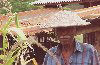 Mantuto: village man with traditional hat in his cornfield