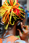 Port of Spain, Trinidad and Tobago: woman with colourful ropes on the hair - on the phone - carnival - photo by E.Petitalot