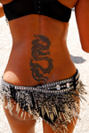 Port of Spain, Trinidad and Tobago: tattoo of a dragon on the back of a Trinidad girl - photo by E.Petitalot