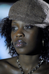 Port of Spain, Trinidad and Tobago: black woman with glossy lips wearing a cap - photo by E.Petitalot