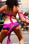 Port of Spain, Trinidad and Tobago: curly woman dancing during carnival - from behind - photo by E.Petitalot