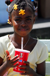 Port of Spain, Trinidad: a girl drinks a soda - photo by E.Petitalot