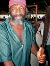 Trinidad - Port of Spain: a butcher and his machete - photo by P.Baldwin