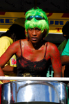 Port of Spain, Trinidad and Tobago: steelpan - drummer with green hair playing in a steelband during carnival - photo by E.Petitalot
