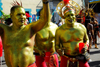 Port of Spain, Trinidad and Tobago: men in gold body painting celebrate carnival - photo by E.Petitalot